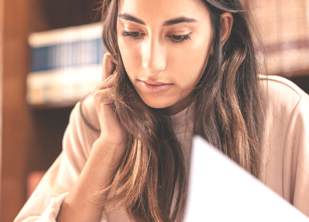 A woman at a library doing research