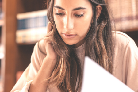 A woman at a library doing research