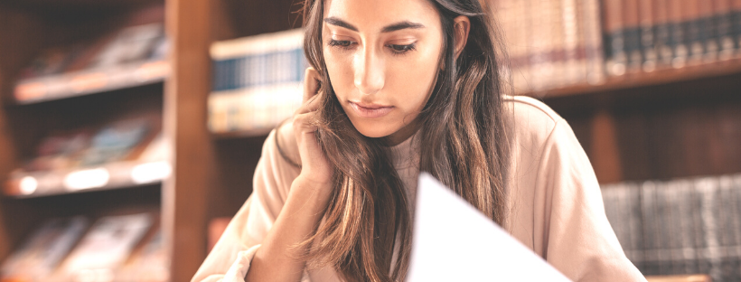 A woman at a library doing research