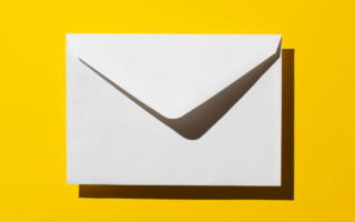 a white envelope on a yellow background