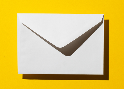 a white envelope on a yellow background