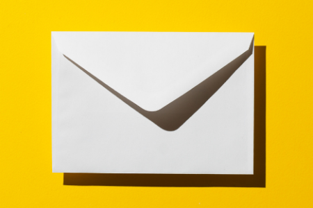 a white envelope on a yellow background