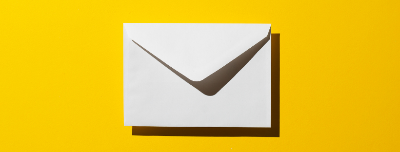 a white envelope on a yellow background