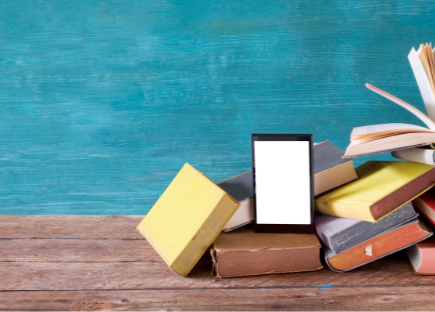 Books on a brown shelf with a teal background