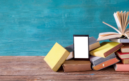 Books on a brown shelf with a teal background