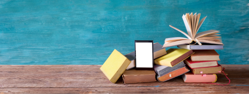 Books on a brown shelf with a teal background